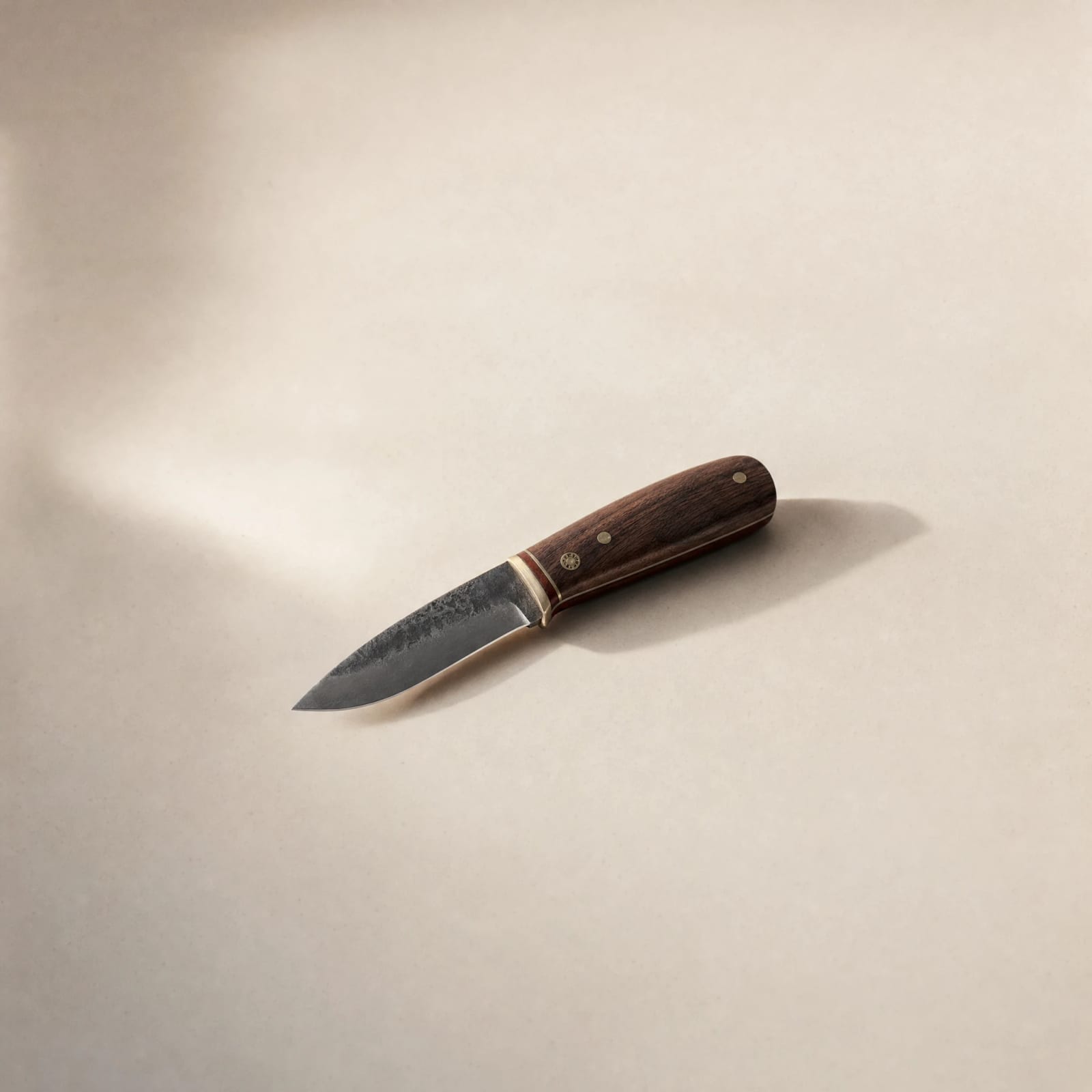 No. 05 Field Knife — carbon steel blade with an oiled walnut handle